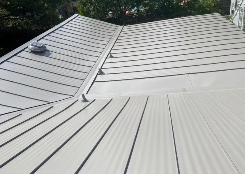 Solar attic fan installed on a metal roof for Roof Ventilation in Terrytown